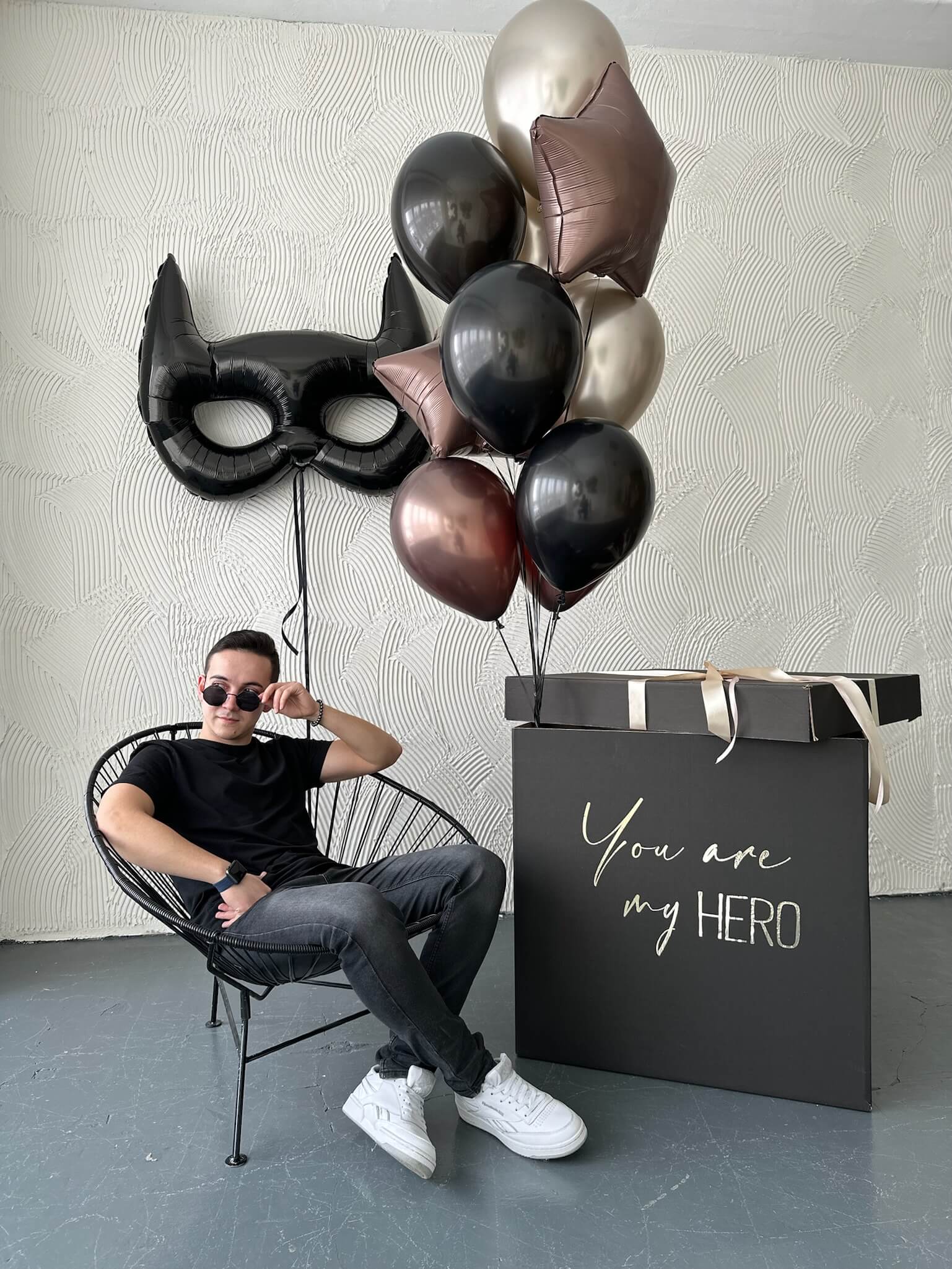 Black and metallic balloon bouquet with star and character balloons